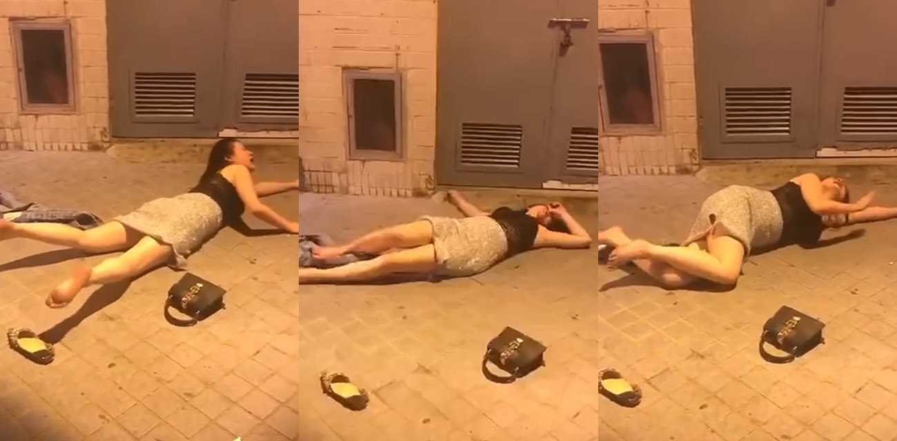 下班回家的路上 一个醉酒美女躺在地上不停嚎哭翻滚 兄弟们遇到这种情况该怎么办？