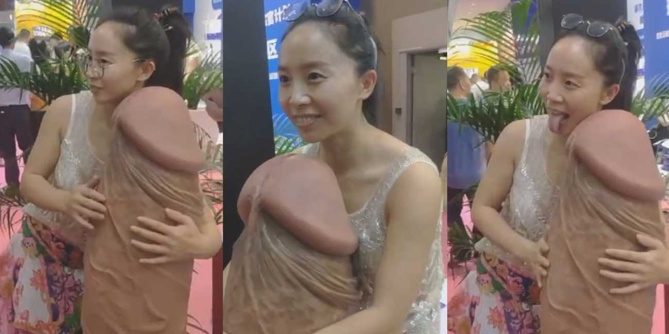 眼镜妹在成人展上看见大屌 当场走不动道了 各种姿势跟着抱着大屌合影！